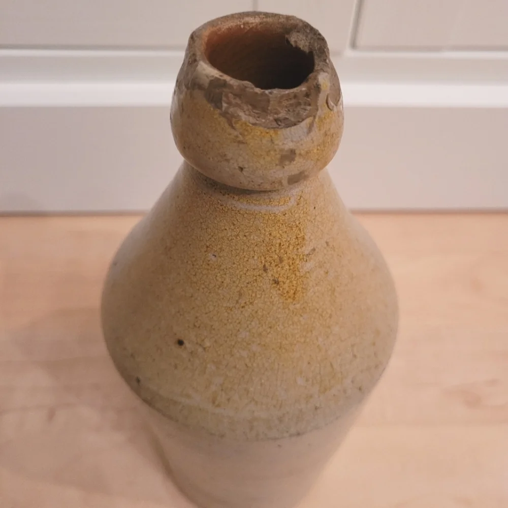 Antique John Howell cream beige pottery stoneware whiskey jug